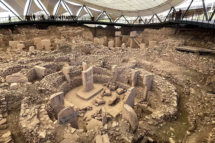 Excavated enclosures with central T-shaped pillars under the roof on a Gobekli Tepe tour from Şanlıurfa, Turkey